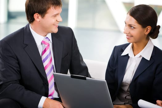 Confident business people are discussing business strategy in the office