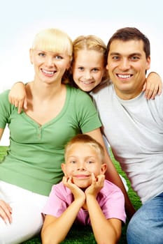 Portrait of happy family in casual clothes looking at camera