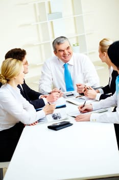 Image of senior leader making speech at meeting