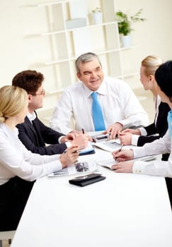 Image of senior leader making speech at meeting