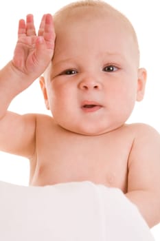 Photo of sweet baby touching forehead with funny expression