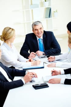 Image of senior leader making speech at meeting