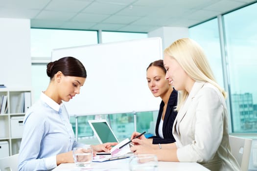 Portrait of three females working in office