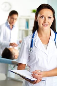 Portrait of confident female doctor looking at camera in hospital
