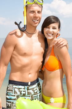 Portrait of happy couple looking at camera and smiling