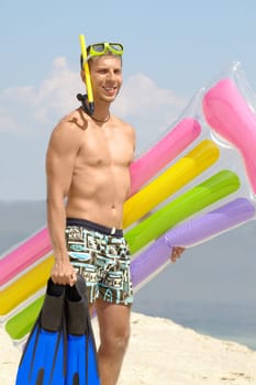Portrait of a man in scuba looking at camera and smiling