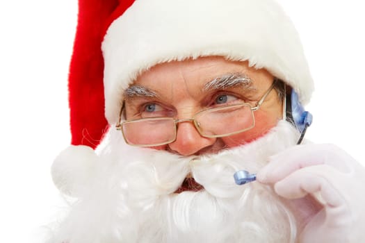Photo of Santa Claus with headset talking to somebody