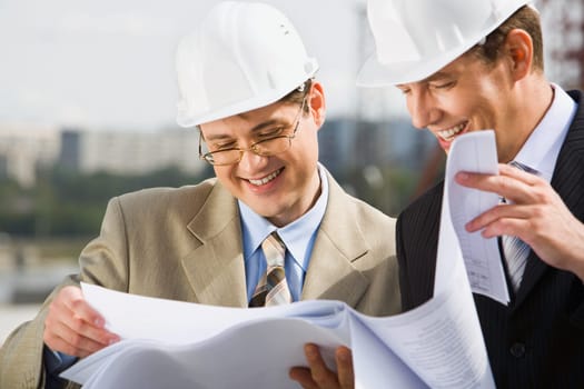 Confident architect  is proposing a new plan of building to his chief