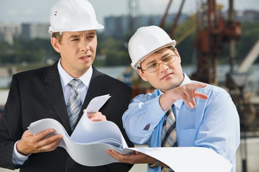 Director is showing a place of construction to the architect