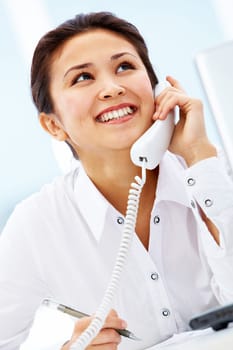 Portrait of smiling consultant speaking by telephone