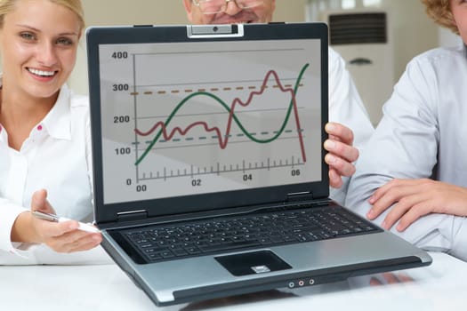 Portrait of successful business partners showing new computer project
