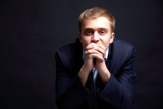 Portrait of stylish businessman looking at camera