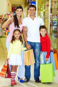 Portrait of happy family during shopping