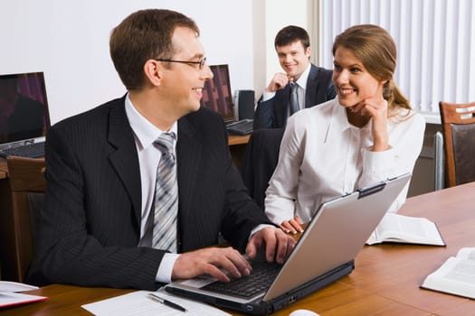 A man explains the marketing plan of work to his colleague in business environment