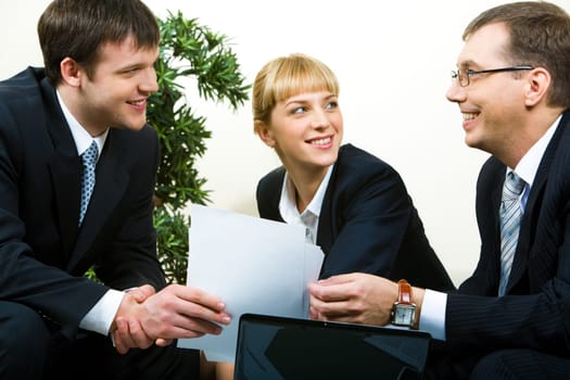 Image of confident man passing necessary agreement to the business partner
