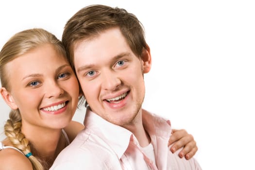 Close-up of happy couple looking at camera close to each other
