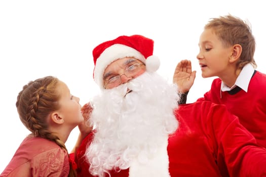 Image of Santa listening to little boy and girl whispering their wishes for Christmas