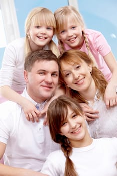 A young friendly family looking at camera