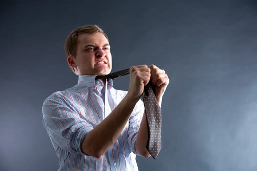 Portrait of young man in problem showing his dissatisfaction