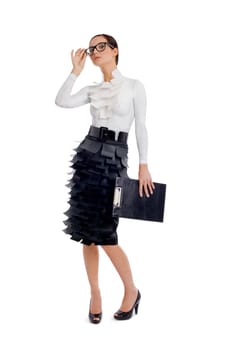Portrait of elegant businesswoman with folder in hand posing before camera