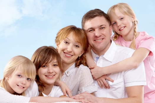 A young friendly family looking at camera
