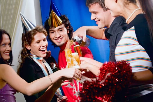 Group of five happy friends at a party