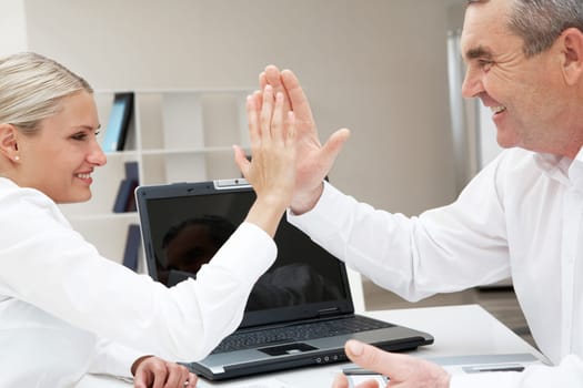 Image of business partners with their palms opposite each other symbolizing support