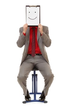Portrait of businessman holding document with smile near his face