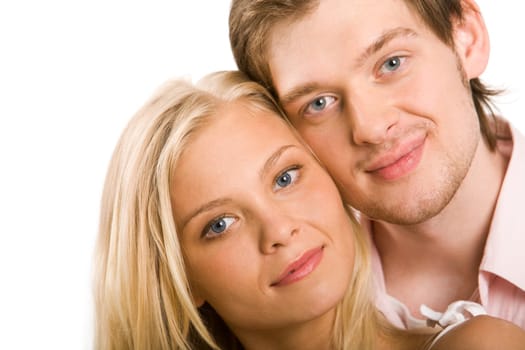 Handsome guy looking at camera with lovely girlfriend by his side