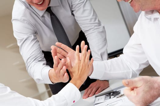 Close-up of business people palms opposite each other symbolizing support and unity