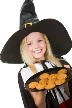 Photo of girl in halloween costume holding tray with bisquits