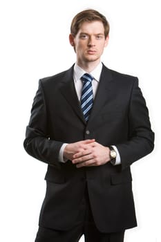 Portrait of young handsome businessman looking at camera on white background