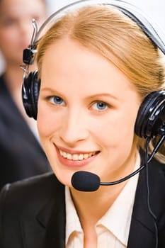 Face of young smiling confident consultant with blue eyes
