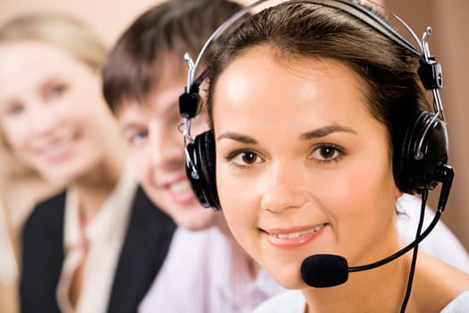 Portrait of friendly telephone operator with headset