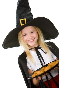 Photo of girl in halloween costume holding tray with bisquits