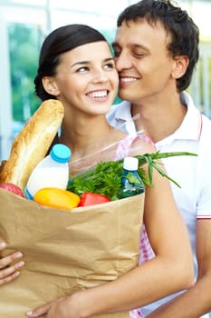Portrait of a happy couple with foodstuff