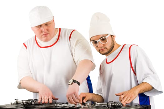 Portrait of two smart deejays at work spinning turntables