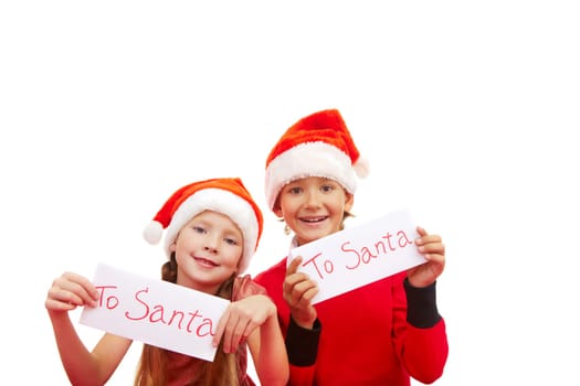 Happy children holding small papers with note To Santa