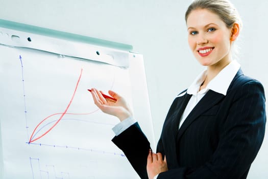 Image of business woman in suit showing a project
