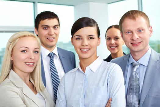 Portrait of young business people looking at camera and smiling