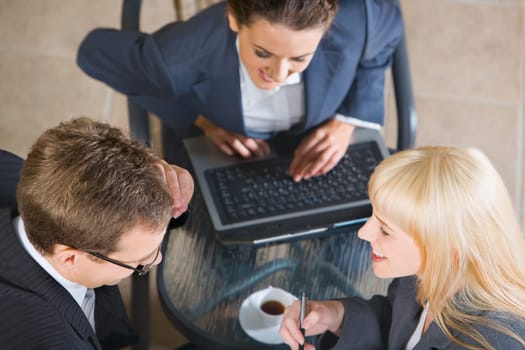 Photo of confident smiling people at business meeting