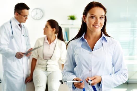 Portrait of confident female doctor looking at camera in hospital