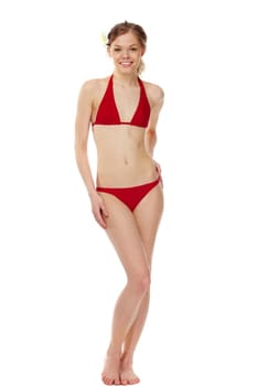 Portrait of a young girl in red bikini isolated on white