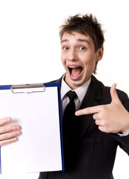 Photo of surprised businessman pointing at blank paper in his hand