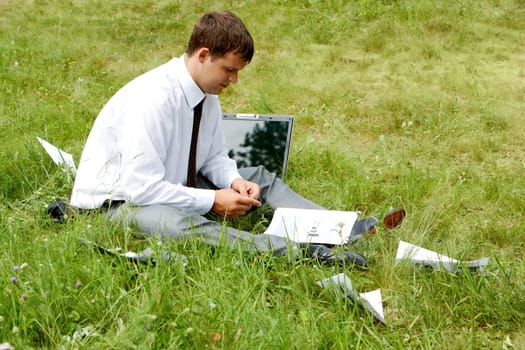 Photo of pensive businessman looking at document and thinking about work