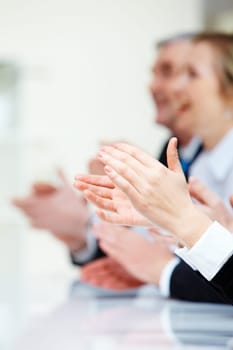 Photo of business partners hands applauding at meeting