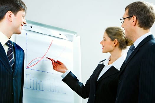 Image of successful woman explaining a right away of business-plan to her colleagues