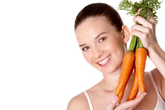 Portrait of pretty girl with ripe carrots smiling at camera over white background