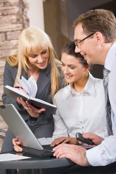 Business woman is demonstrating a text to her colleagues