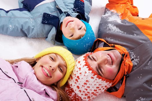 Above angle of happy family looking at camera
